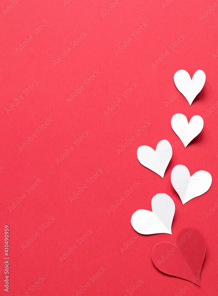 Valentine's Day background. Red and white hearts on a red background.