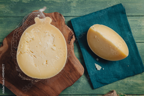 Delicious Caciocavallo cheese on a wooden board photo