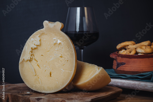 Delicious Caciocavallo cheese on a wooden board photo