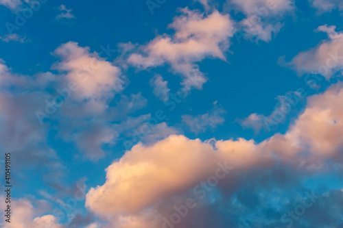 evening blue sky with golden clouds as natural background
