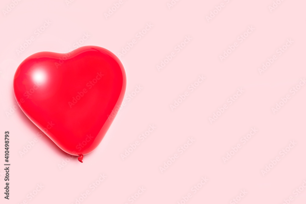 Heart shaped balloon on a pink background. Valentine's day concept.