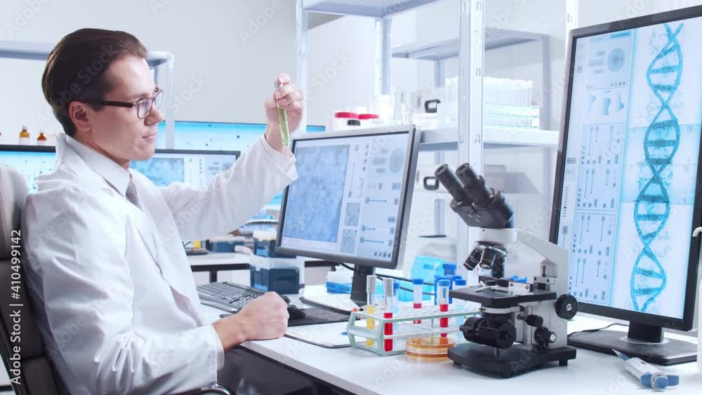 Professional scientist is working on a vaccine in a modern scientific research laboratory. Genetic engineer workplace. Futuristic technology and science concept. Professional scientist is working on a vaccine in a modern scientific research laboratory. Genetic engineer workplace. Futuristic technology and science concept.