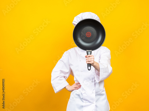 Chef cook covers his face w...