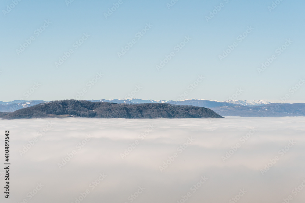 Dense fog over rural fields in West Serbia