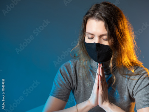 Catholic woman folded her p...