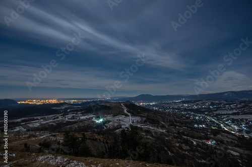 Panorama of a winter village at night in the mountains