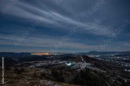 Panorama of a winter village at night in the mountains