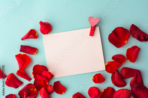 greeting card with a red heart and space for text on a blue background photo