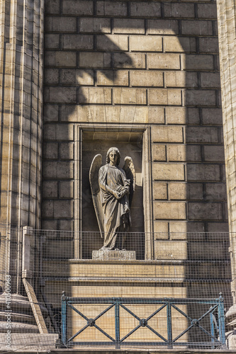 Madeleine Church (Eglise de la Madeleine) - one of most famous churches of Paris; temple to glory of Napoleon's army. Statues adorning the cathedral from the outside. Paris; France.