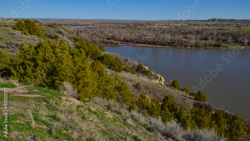 Valley with a slowly flowing river, glare of the sun. Montana nature