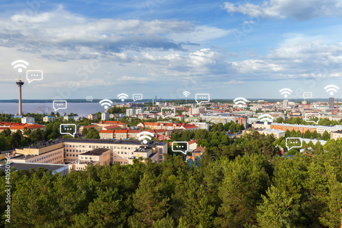 Näsinneula observation tower and the city of Tampere, Finland, viewed from above on a sunny day in the summer. Wireless network connection, WiFi, smart city and online messaging concept. 