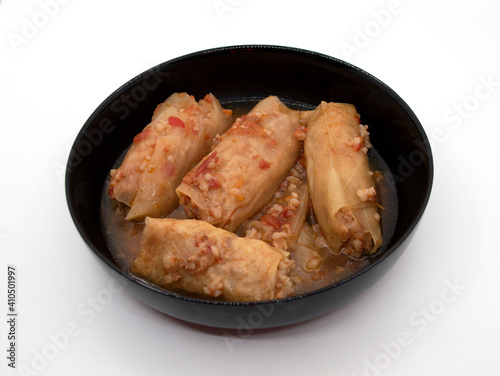 Dish of cabbage rolls in a black plate