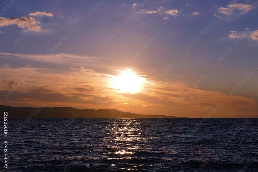 Orange sunset in the sea and reflection