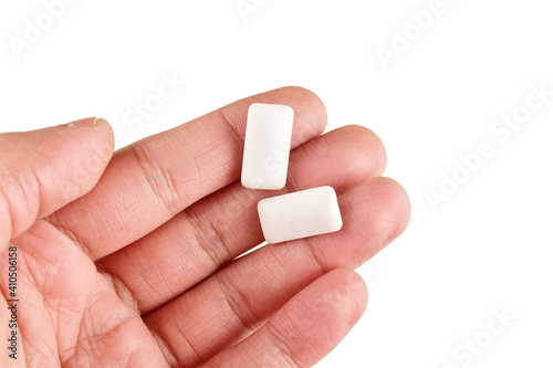 Fotografie Mint chewing gum in hand isolated on white background with clipping path