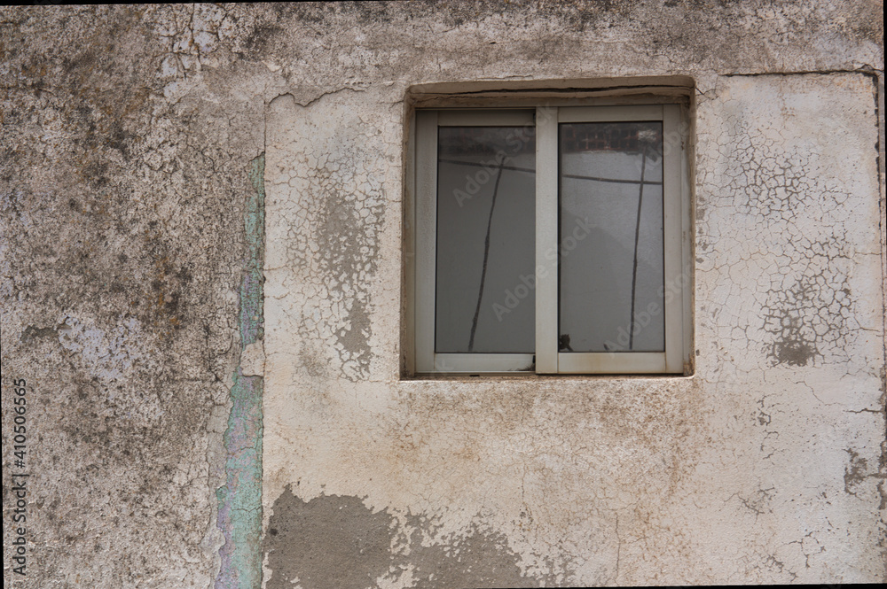 Wall worn by time with window and copy space