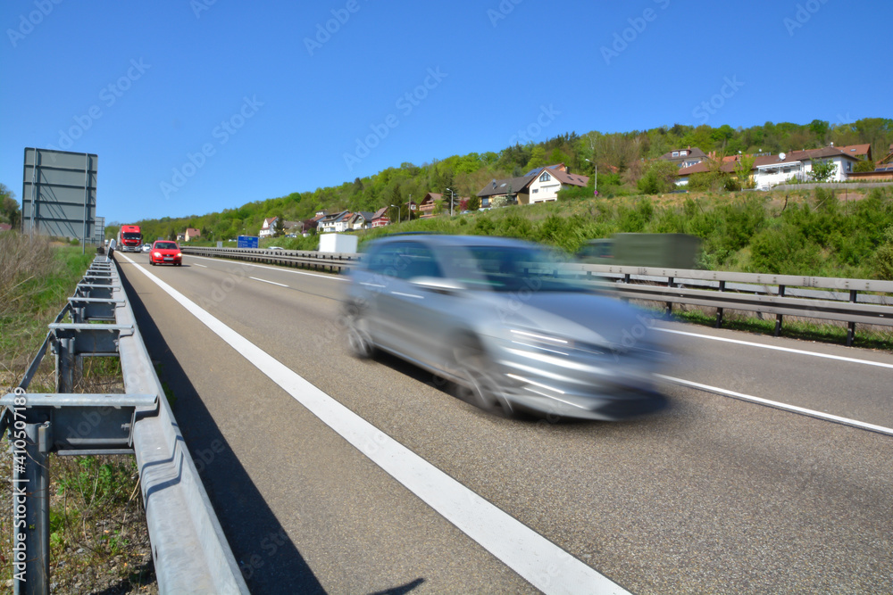 Motorway fast driving cars highway swoosh blurred