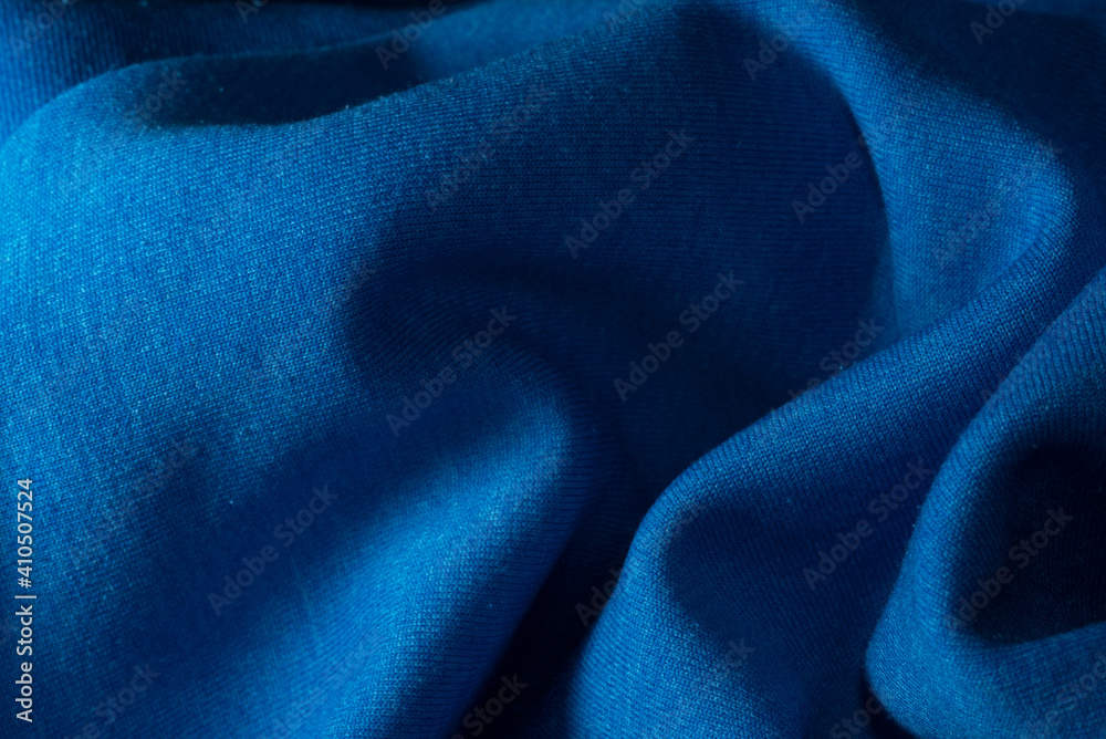 la texture creata da un tessuto di colore blu, una stoffa di colore blu la texture creata da un tessuto di colore blu, una stoffa di colore blu