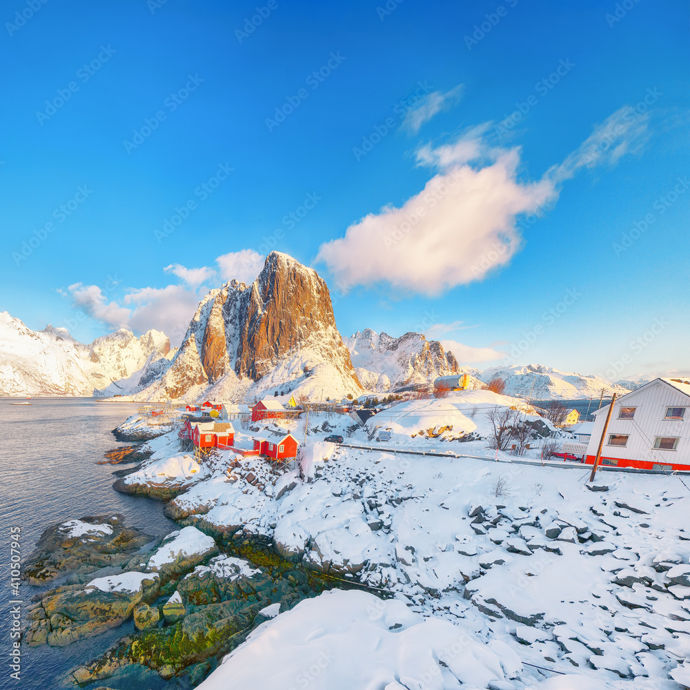 Fantastic winter view on Hamnoy village and Festhaeltinden mountain on background.