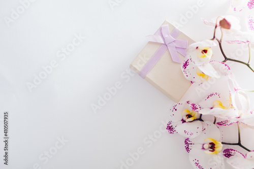 Gift boxes with orchid on white background. Presents for Valentine's day
