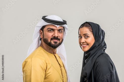 ARabian couple isolated on grey background