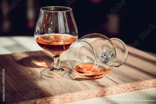 Two glasses of cognac on the bar table