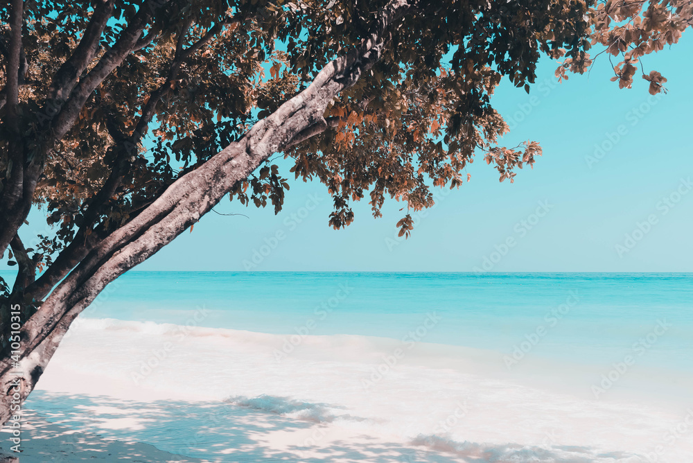 Vintage and retro toning of tropical beach with blue sky and clear sea which including of a wooden boat in sunrise time with vintage retro tone. Vacation time as concept.