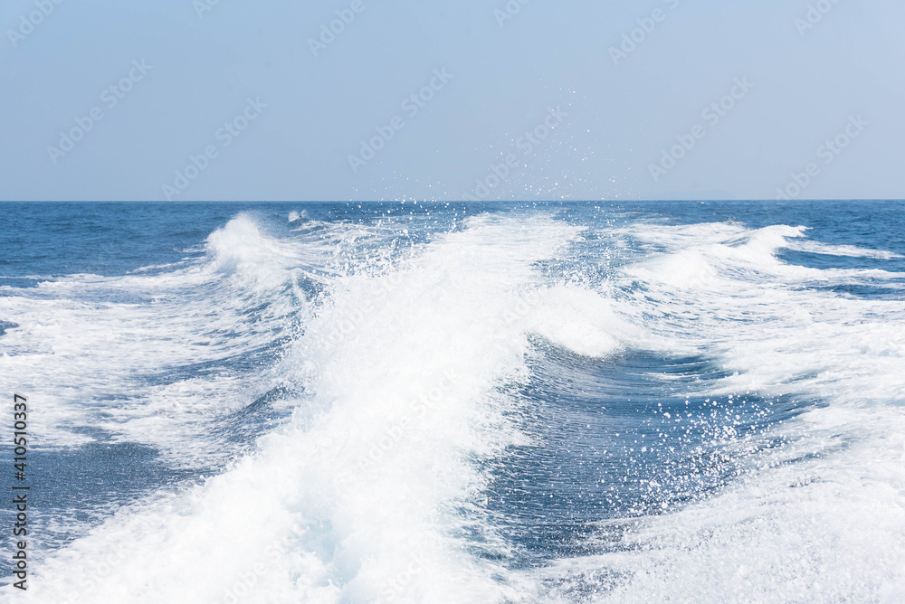 Fototapeta premium Vintage and retro toning of tropical beach with blue sky and clear sea which including of a wooden boat in sunrise time with vintage retro tone. Vacation time as concept.