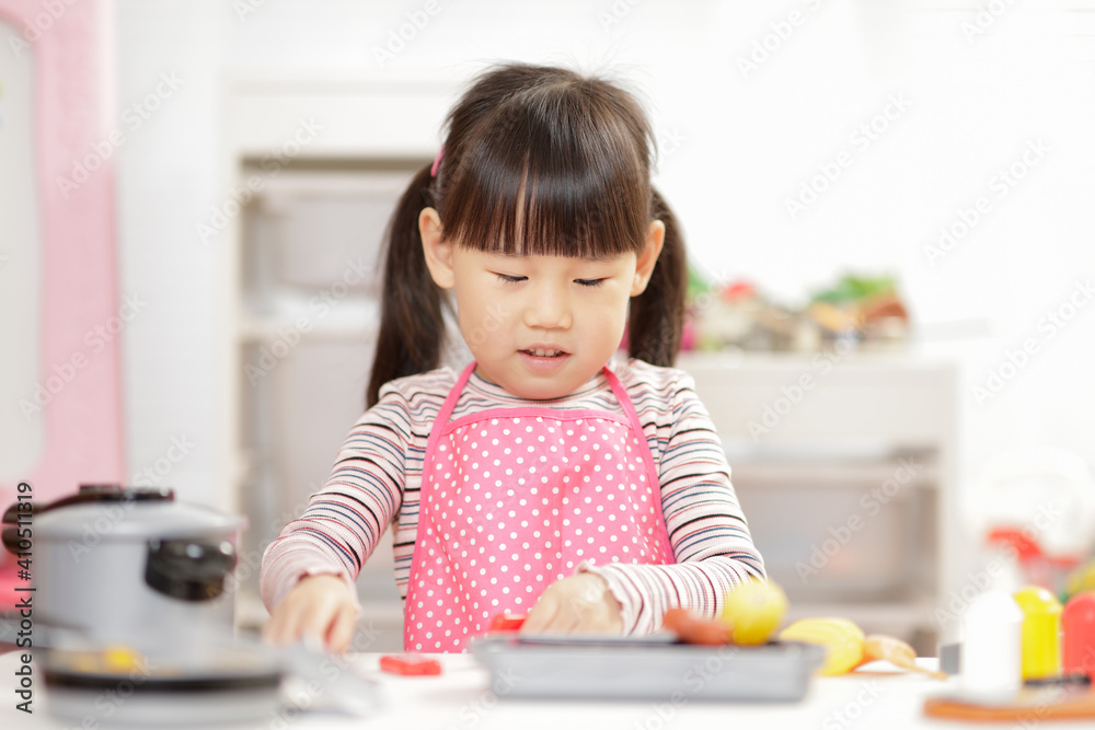young girl pretend play food preparing at home young girl pretend play food preparing at home