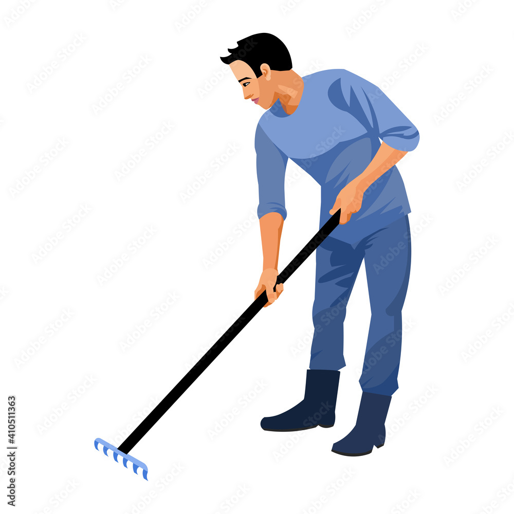 Asian gardener weeds plants with a rake Asian gardener weeds plants with a rake