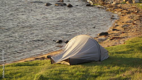 Wild camping at the beach on Styrs   Island at sunset near Gothenburg City in Sweden.