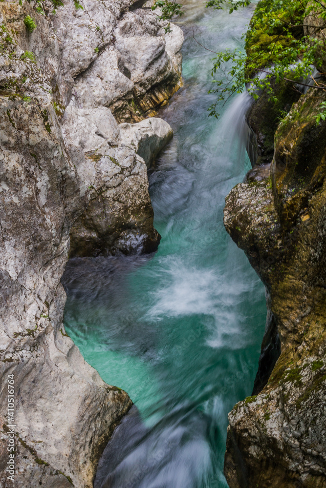 Small waterfall in Soca river gorge near Bovec village, Slovenia Small waterfall in Soca river gorge near Bovec village, Slovenia