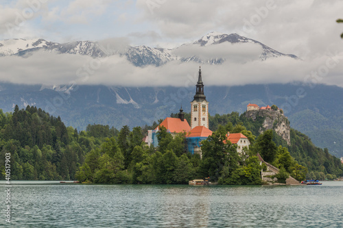 Karawanks mountain range behind Bled lake with the Pilgrimage Church of the Assumption of Maria and Bled Castle  Slovenia