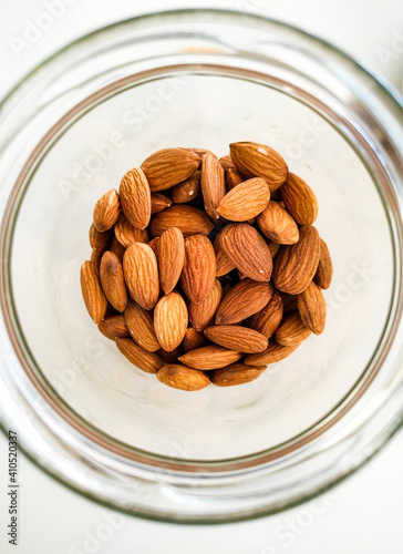 Almonds in the glass bowl.

Zagreb, Croatia - February 1st 2021