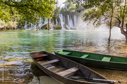 Boats at Kravica waterfalls in Bosnia and Herzegovina
