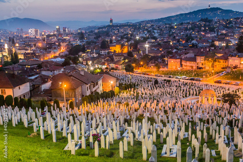 Evening view of city skyline with Kovaci cemetery in Sarajevo. Bosnia and Herzegovina photo