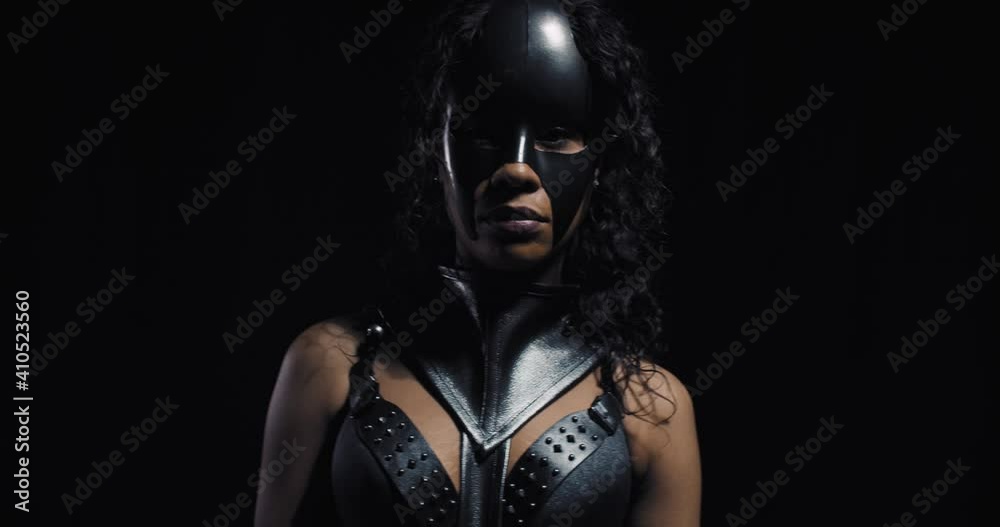 Portrait of a young black woman wearing a mask, catwoman cosplay model, 4k