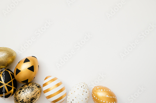 Photography Frame of Easter golden decorated eggs isolated on white background