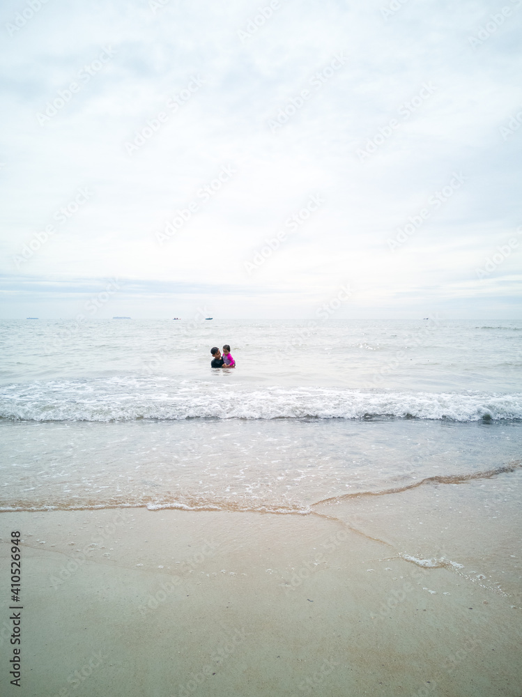 Children swimming at the beach in Malaysia. Children swimming at the beach in Malaysia.