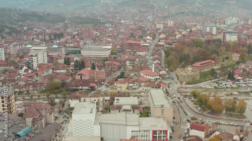 Aerial View of Novi Pazar City, Sandzak Region, Serbia. Multicultural Community on Misty Summer Day, Drone Shot photo