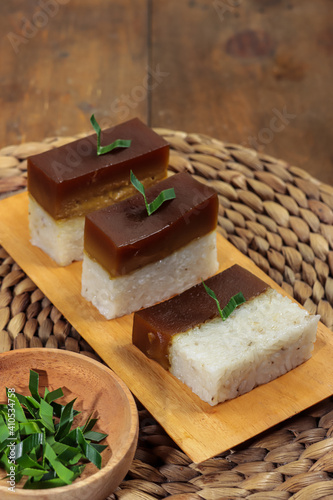 Talam ketan or serimuka kueh or pulut sekaya, made from glutinous rice and palm sugar. Typically Malay food and Indonesian traditional dessert. Also known as the gula malaka custard cake. photo