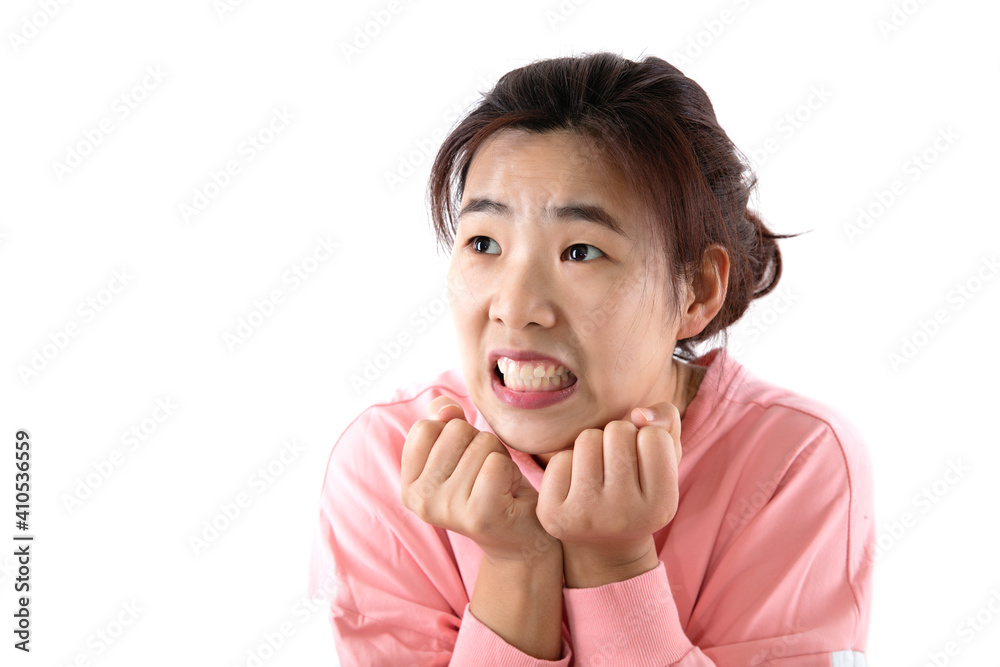 A woman with double fists holding chin and panic expression A woman with double fists holding chin and panic expression