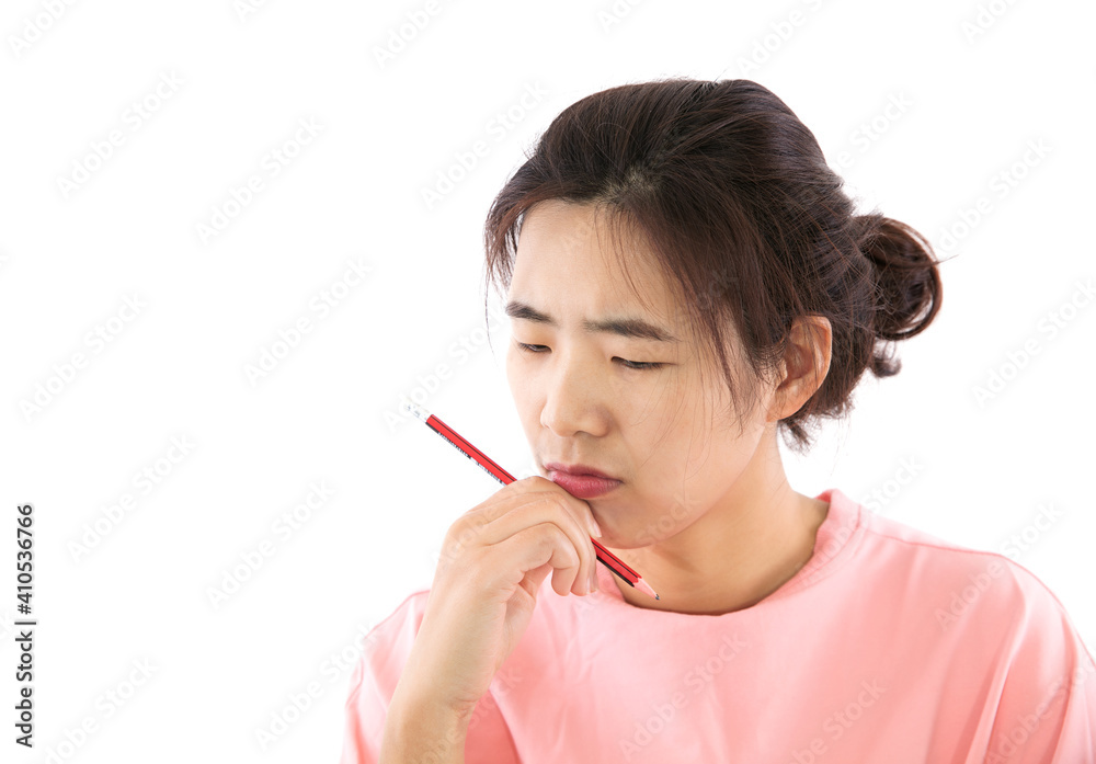 A woman in deep thought with a pencil A woman in deep thought with a pencil