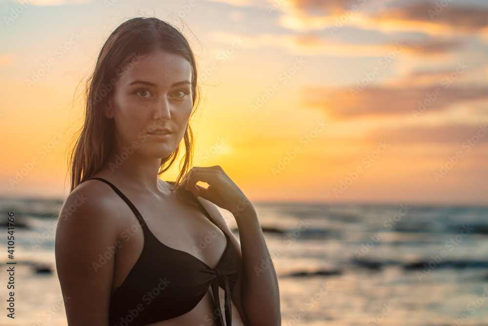 Woman by the Sea at sunset