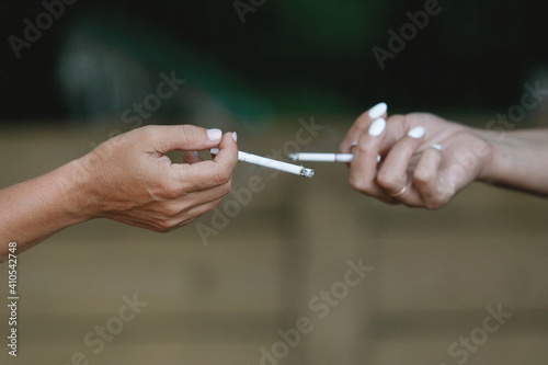 Women s hands with a cigarette