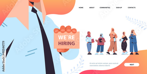 arab hr manager holding we are hiring poster choosing arabic businesspeople applicants vacancy open recruitment concept horizontal copy space vector illustration