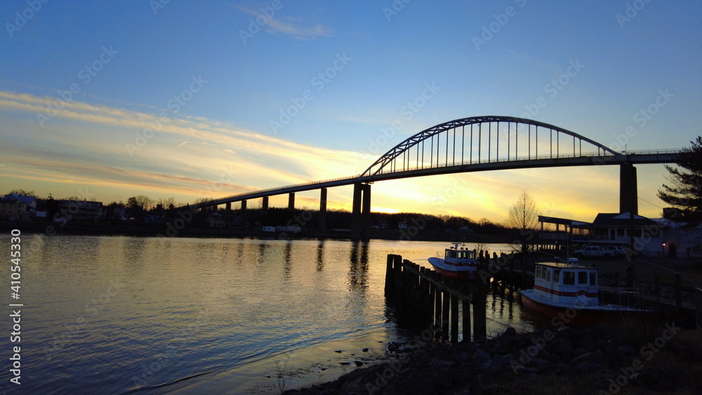 The silhouette of Chesapeake City bridge during sunset near Maryland, U.S The silhouette of Chesapeake City bridge during sunset near Maryland, U.S