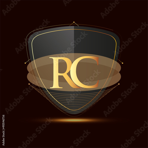 Initial logo letter RC with shield Icon golden color isolated on dark background, logotype design for company identity.