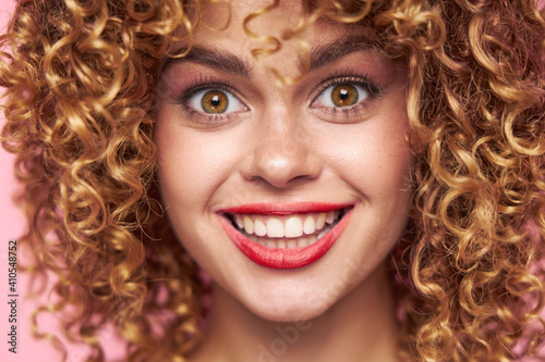 woman curly hair red lips bright makeup close-up charm 