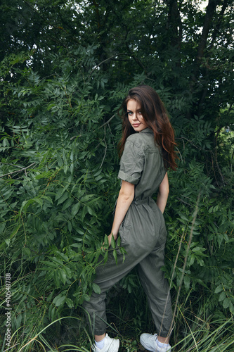Woman in forest Sneakers nature jumpsuit model summer 