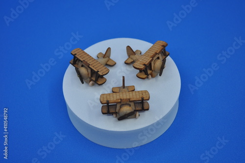 Close up creative shots of small wooden plane models handcrafted from wood, around 3cm X 2cm in size photo